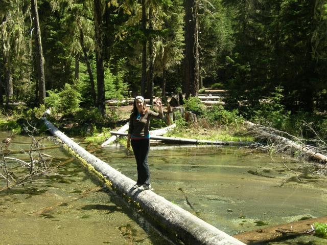 Portland - Sam on log above waterfall