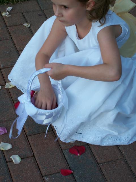 the adorable flower girl actually went back after the ceremony to get her petals!