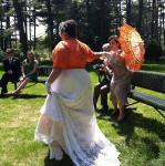 Vik hands off her umbrella