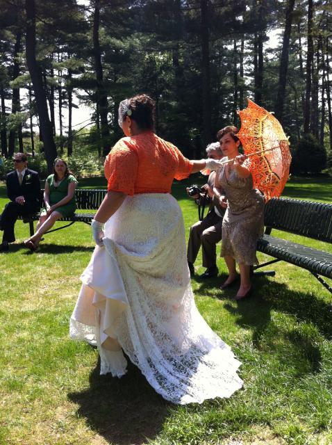 Vik hands off her umbrella